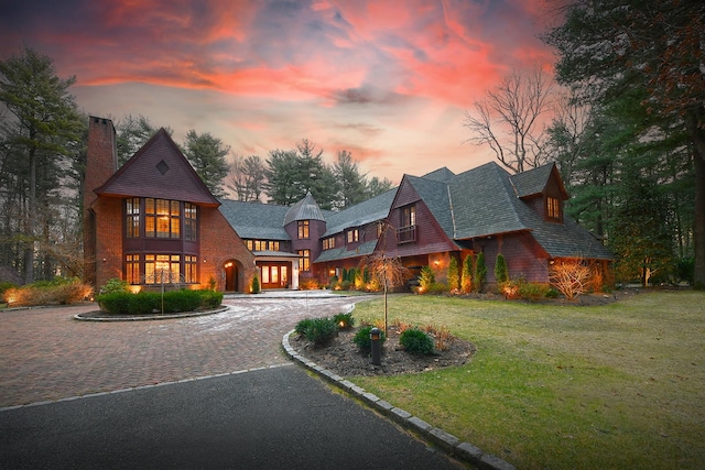 view of front of property with a lawn