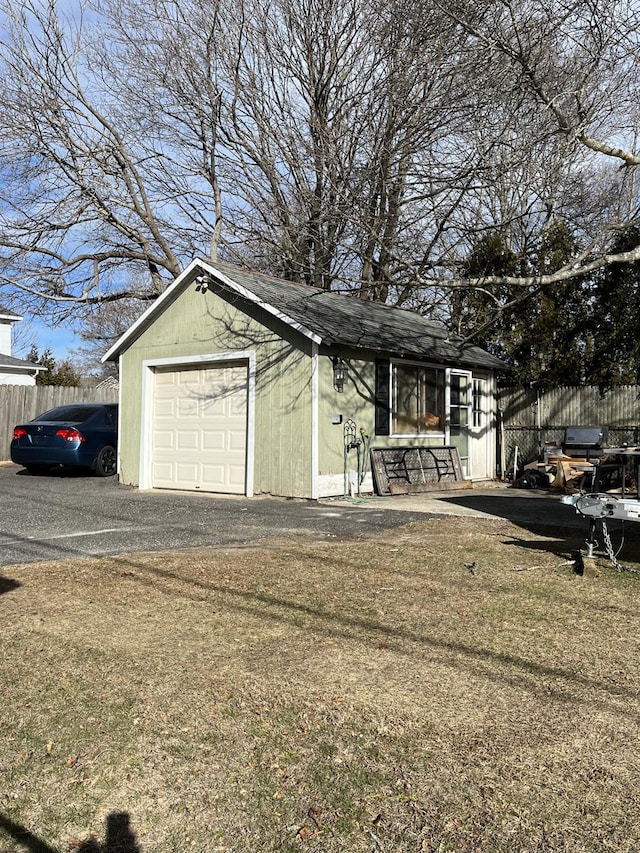 view of front of home with an outbuilding and a garage