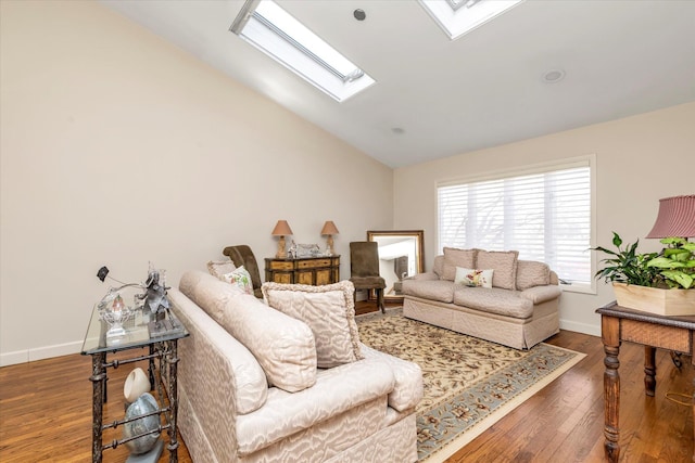 living room with lofted ceiling with skylight and dark wood-type flooring