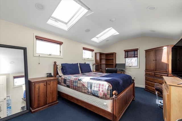 bedroom featuring dark carpet, multiple windows, and vaulted ceiling