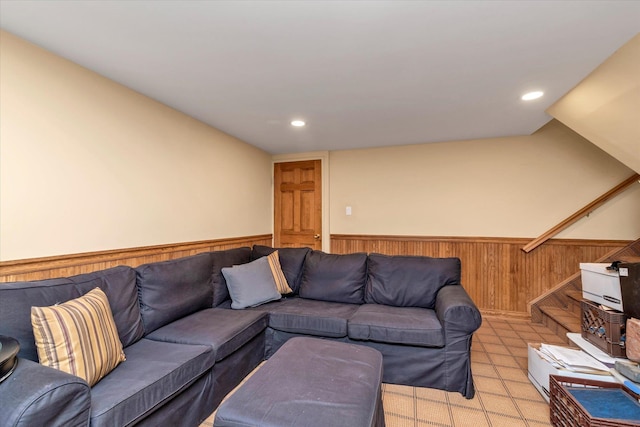 living room featuring wood walls