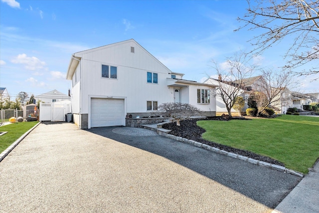 view of front facade with a front lawn and a garage