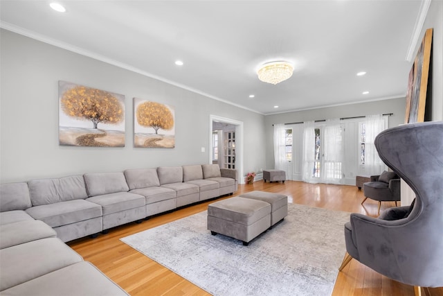 living room featuring french doors, recessed lighting, ornamental molding, wood finished floors, and baseboards