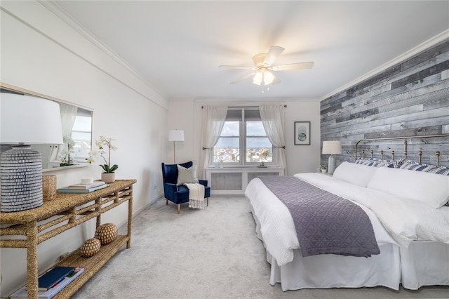 bedroom featuring light carpet, ceiling fan, and crown molding