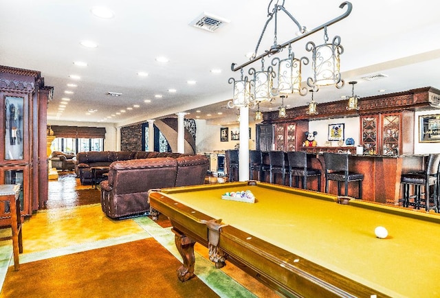 rec room with concrete floors, billiards, and bar