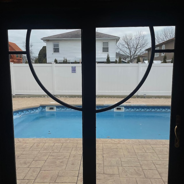 view of swimming pool with fence and a fenced in pool