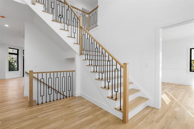 staircase with wood-type flooring