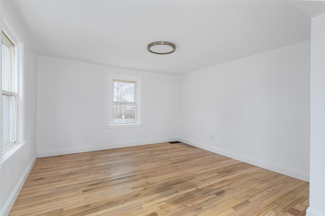 unfurnished room with light hardwood / wood-style flooring