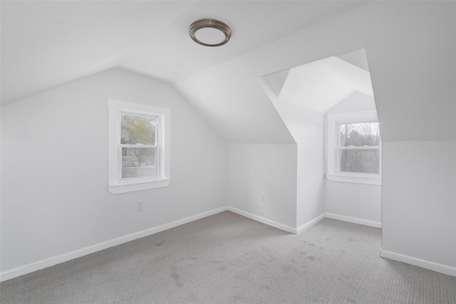 bonus room featuring carpet floors and lofted ceiling