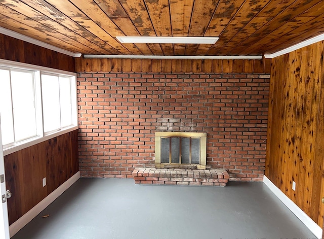 unfurnished living room with wood walls, wood ceiling, and concrete floors