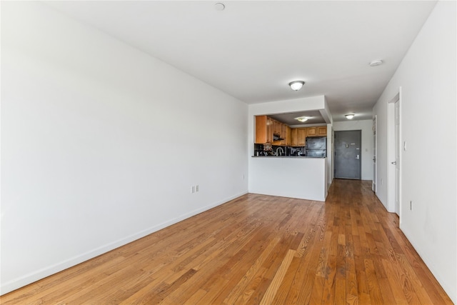 unfurnished living room with light hardwood / wood-style floors