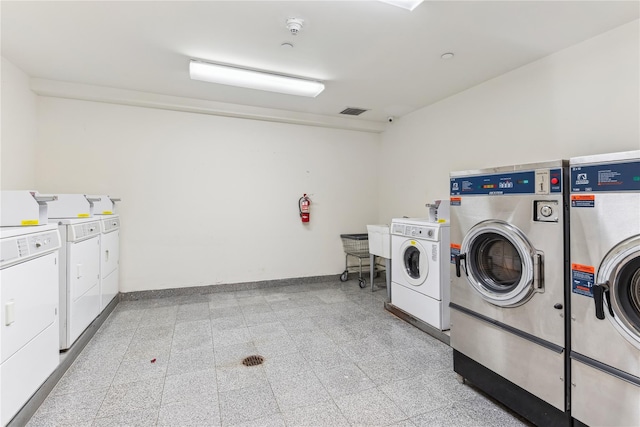 laundry area featuring washing machine and clothes dryer