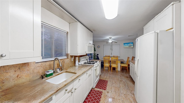 kitchen featuring white cabinets and white appliances