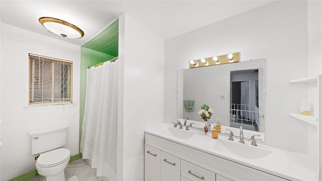 bathroom with vanity, a shower with curtain, and toilet