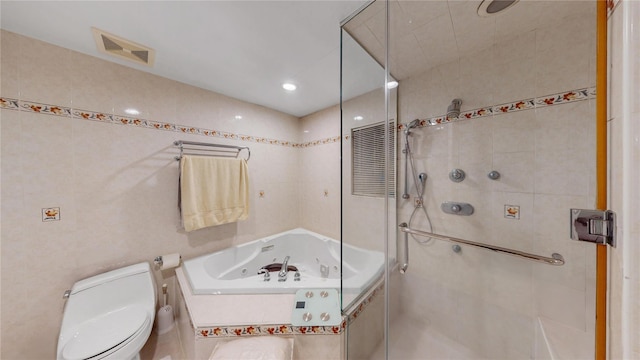 bathroom with shower with separate bathtub, tile walls, and toilet