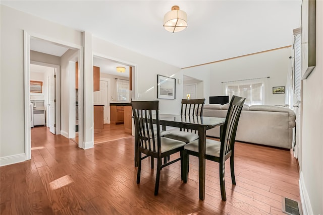 dining area with wood-type flooring