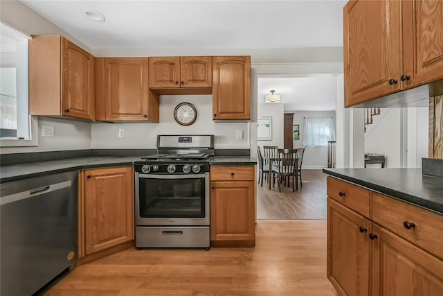 kitchen with stainless steel appliances and light wood-type flooring