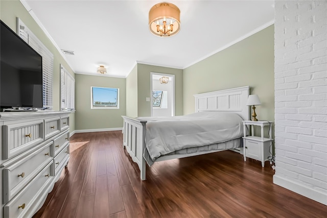 bedroom featuring dark wood-type flooring and ornamental molding