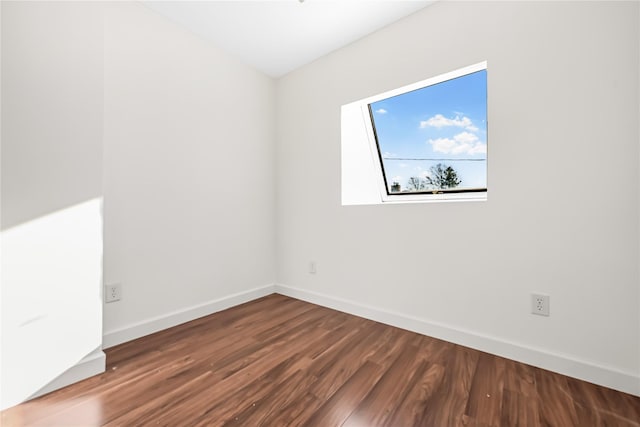 spare room featuring hardwood / wood-style floors