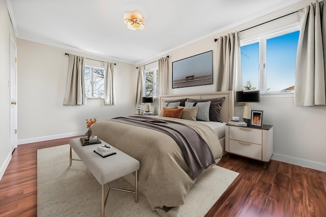 bedroom featuring dark hardwood / wood-style flooring and ornamental molding