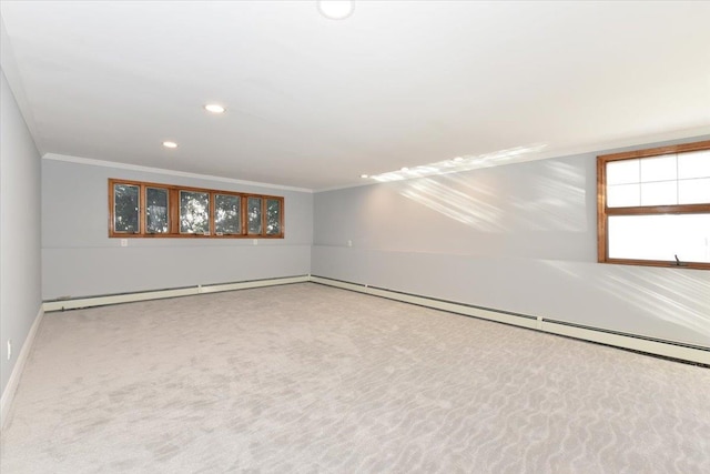 unfurnished room with ornamental molding and carpet