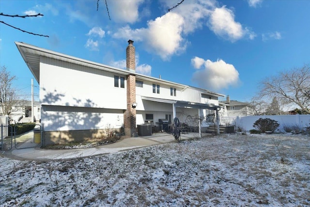 rear view of house with cooling unit