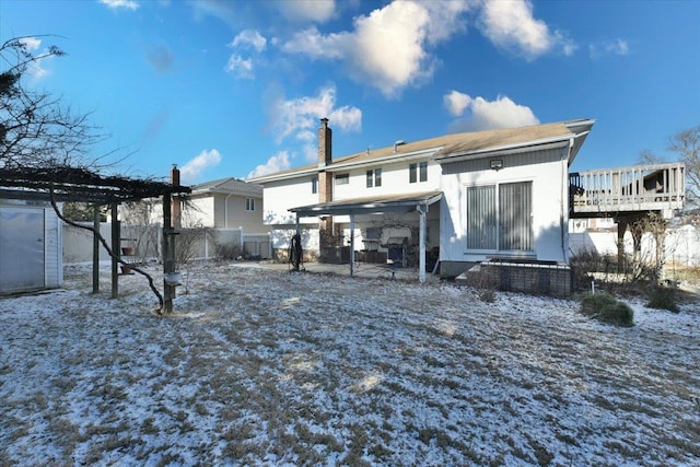 view of snow covered house