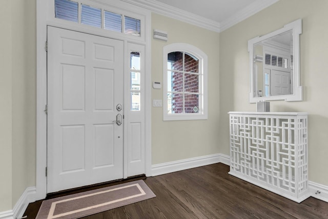 foyer with dark wood-type flooring and ornamental molding