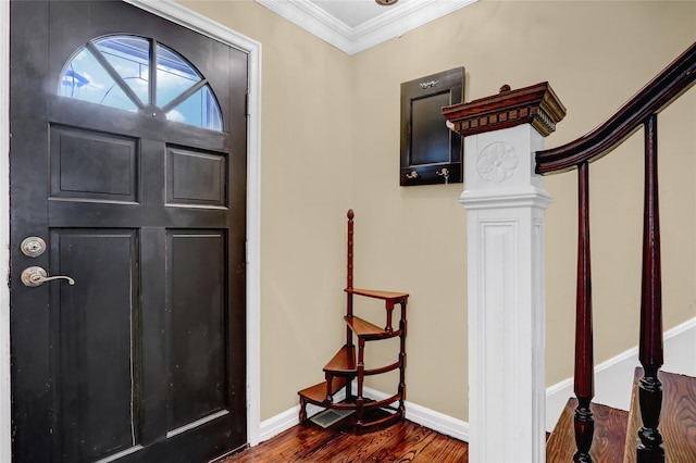 foyer with crown molding and dark hardwood / wood-style flooring