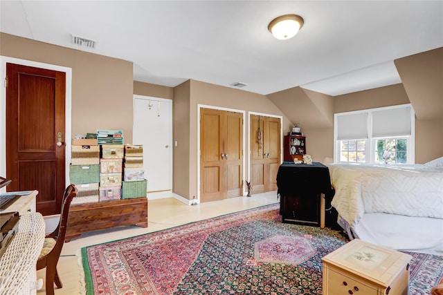 bedroom with multiple closets