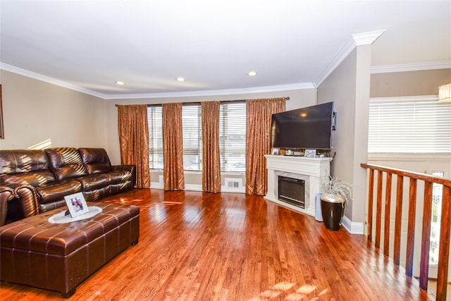 living room with crown molding and hardwood / wood-style floors