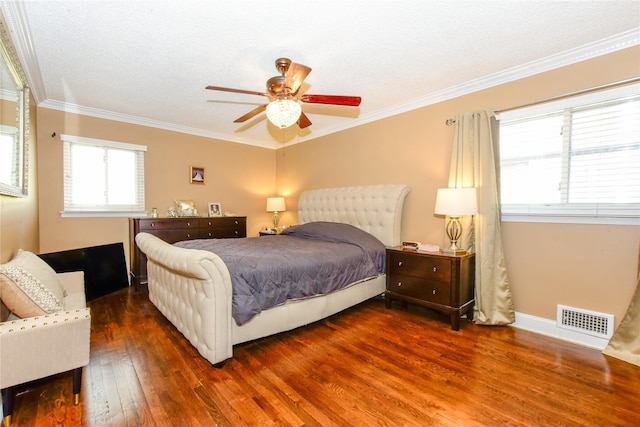 bedroom with ceiling fan, multiple windows, dark hardwood / wood-style floors, and crown molding