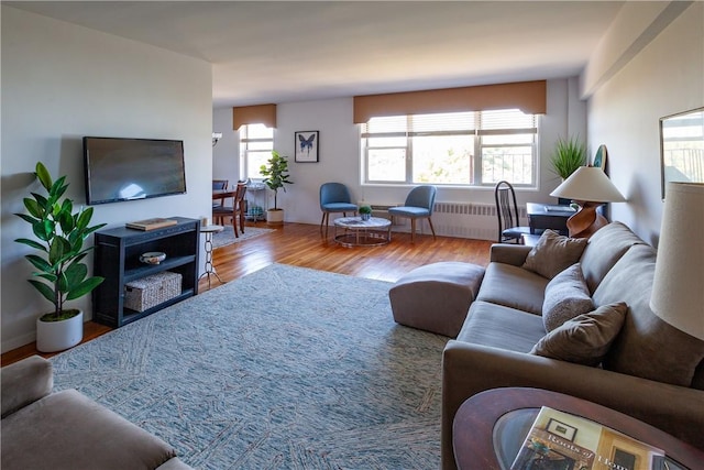 living room with hardwood / wood-style floors and radiator