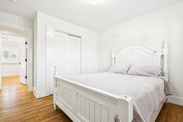 bedroom featuring a closet and hardwood / wood-style floors