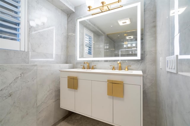 bathroom with vanity, radiator heating unit, tile walls, and walk in shower