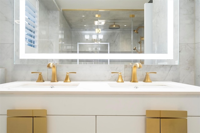 bathroom featuring vanity, decorative backsplash, and a shower with door