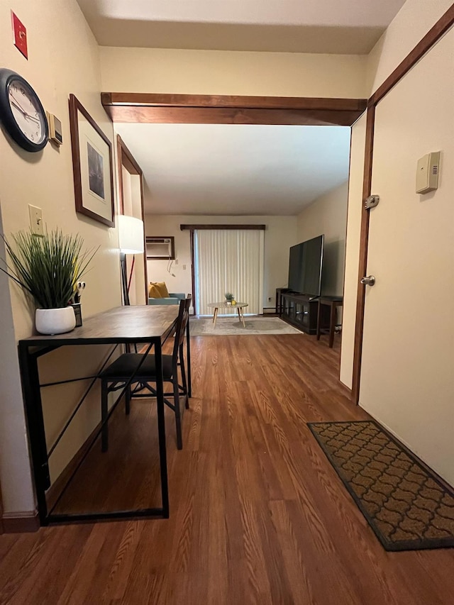 hallway with hardwood / wood-style floors and a wall mounted AC