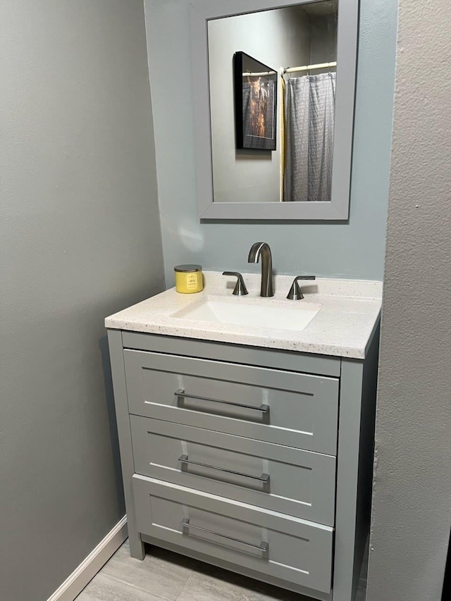 bathroom with vanity and curtained shower