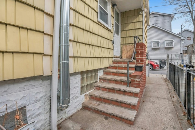 doorway to property with fence