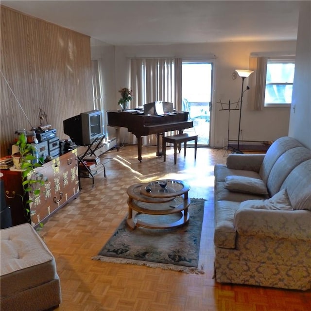 living room featuring light parquet floors and a baseboard radiator