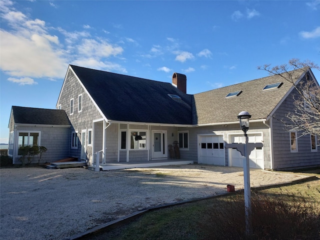 view of front of home with a garage and covered porch