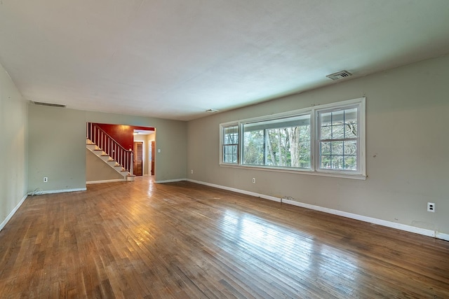 unfurnished room featuring hardwood / wood-style flooring