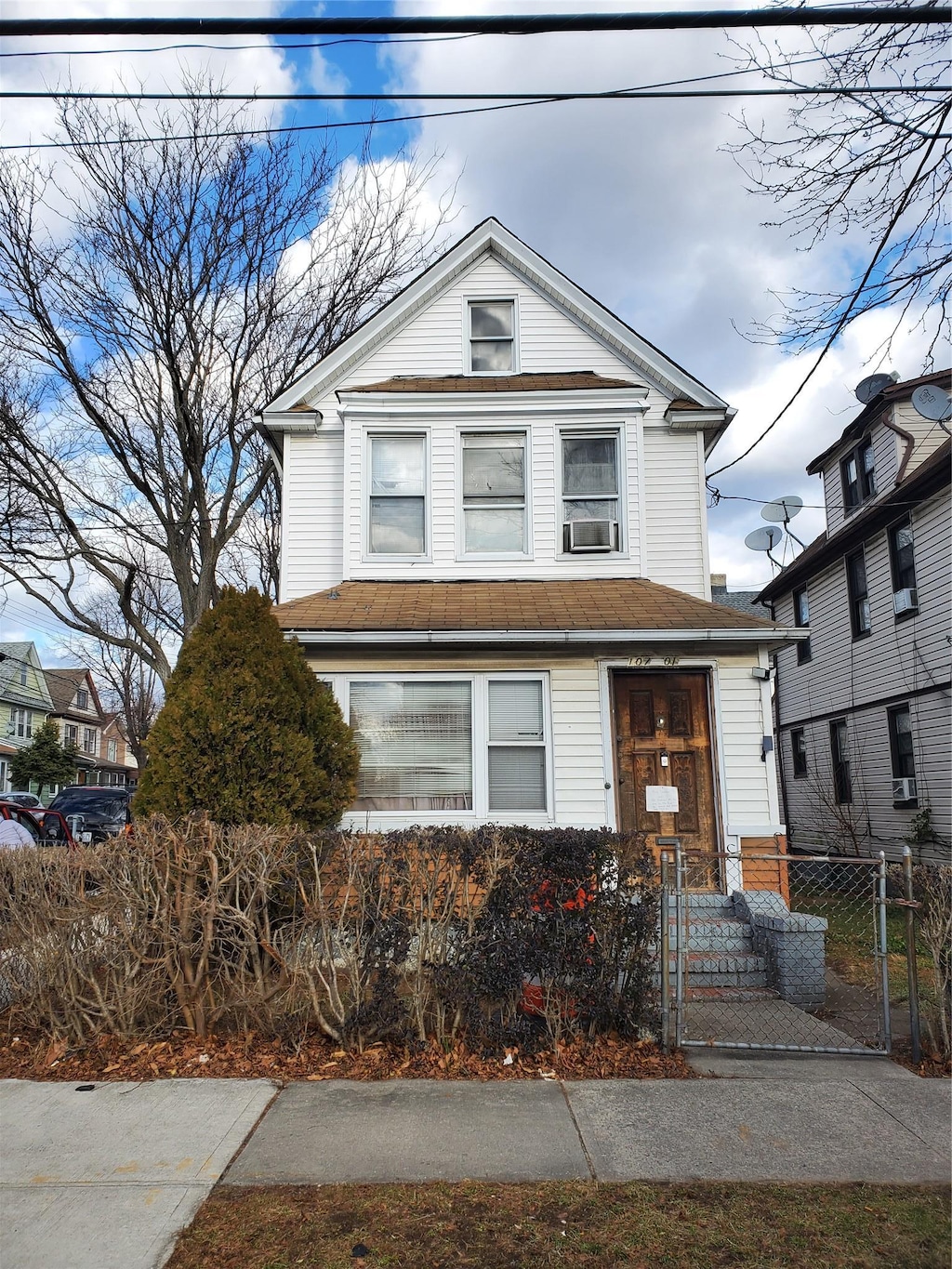 view of front of property featuring cooling unit