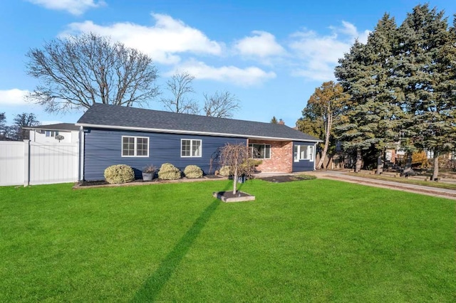 ranch-style home with a front lawn