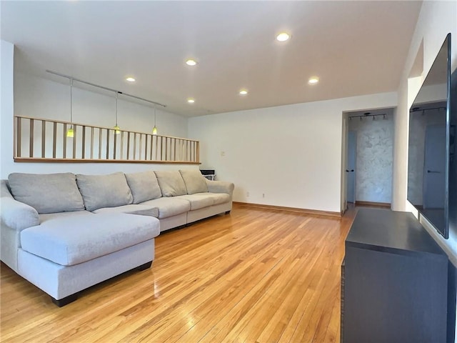 unfurnished living room featuring light wood-type flooring