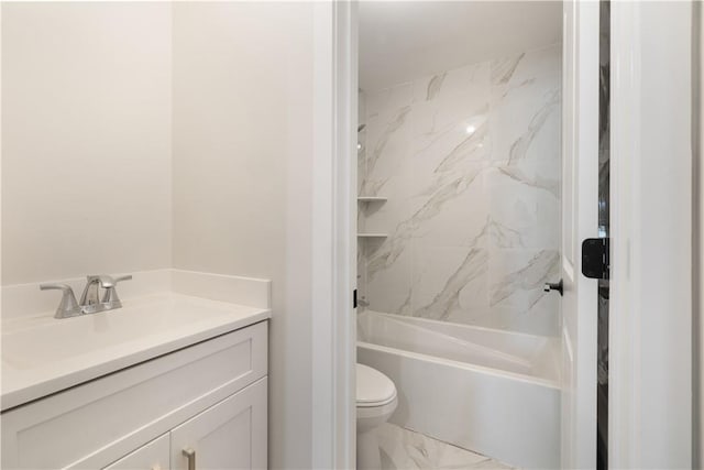 full bathroom with vanity, toilet, and tiled shower / bath combo