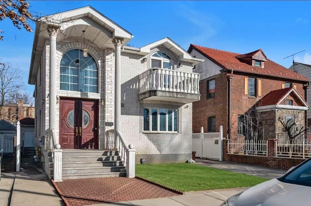 view of front of house with a balcony