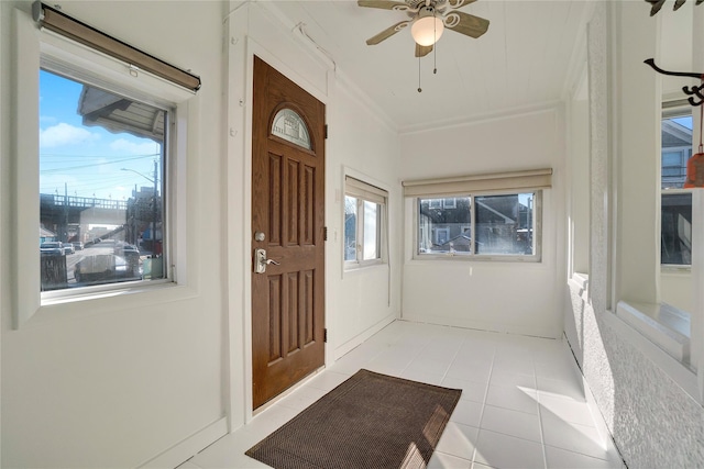 interior space with ceiling fan