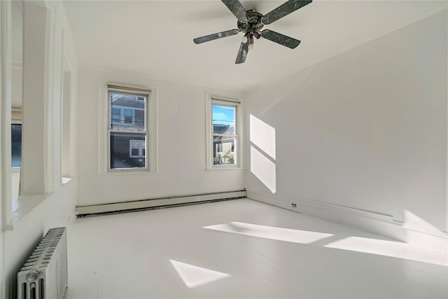 unfurnished room featuring ceiling fan, a baseboard radiator, and radiator