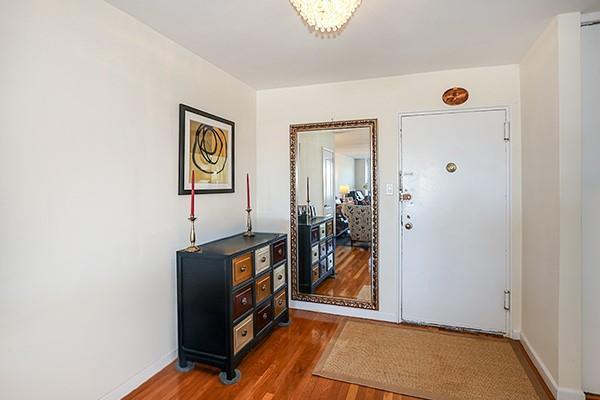 foyer entrance with dark wood-type flooring